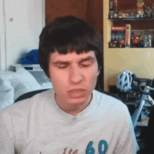 a man wearing a t-shirt with the number 60 on it