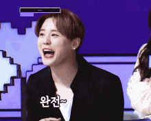 a man is laughing with korean writing on his face