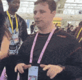 a man wearing a lanyard with a name tag that says ' amanda ' on it