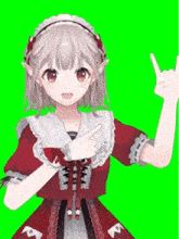 a girl in a red dress is making a peace sign with her hand
