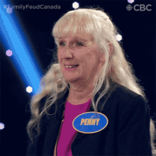 an older woman with a name tag that says penny on it