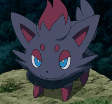 a pokemon with a red tail and blue eyes is standing on a rock