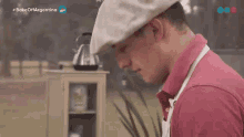 a man wearing a hat and apron is standing in front of a cabinet with the words bake off argentina written on it
