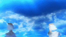 a bride and a bridegroom are standing in the clouds