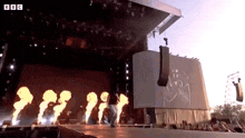 a bbc logo can be seen on a stage