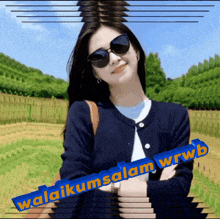 a woman wearing sunglasses stands in a field with the words " selamat wrwb " written below her