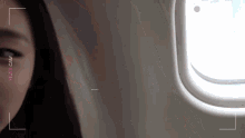 a close up of a woman 's face with the words yeji 's cam on the bottom right