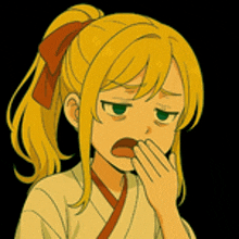 a girl with blonde hair and green eyes is covering her mouth with her hand .