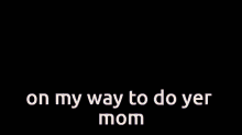 a man in a suit and tie is sitting at a table and says " on my way to do yer mom "
