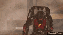 a robot with a crown on its chest is standing in a room with smoke coming out of it 's mouth .