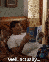 a man is laying on a couch reading a book called swiss
