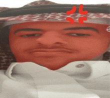 a close up of a man 's face with a scarf on