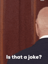 a close up of a man 's back with the words " is that a joke " below him