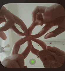 a group of hands making a circle with their fingers