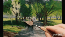 a person is painting a landscape with the words made in animotica below it