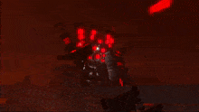 a silhouette of a man is standing in front of a fire