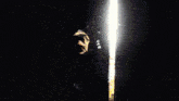 a silhouette of a man with a gun standing in a doorway
