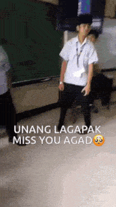 a man in a school uniform is dancing in a classroom with the words " unang lagapak miss you agado " on the floor