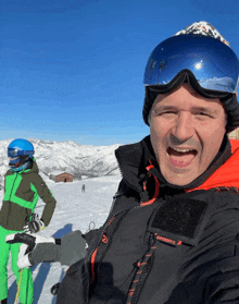 a man wearing a jacket that says superdry is smiling