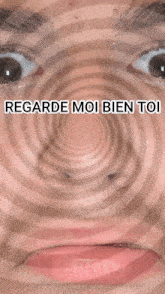 a close up of a woman 's face with regarde moi bien toi written on the bottom