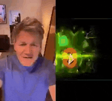 a man in a blue shirt is standing in front of a green screen