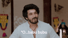 a man with a beard says " o babu bubu "