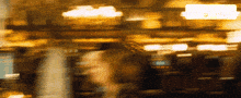 a blurred image of a bakery with a sign that says missgif.com
