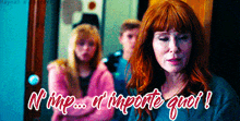 a woman with red hair stands in front of a sign that says " n'hap ... n'importe quel ! "