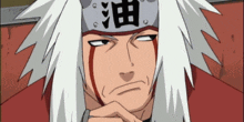 a man with white hair and a headband with chinese characters on it