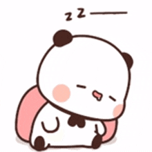 a panda bear is sleeping on a pillow .
