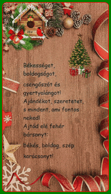 a christmas card with a gingerbread house and a christmas tree on a wooden background