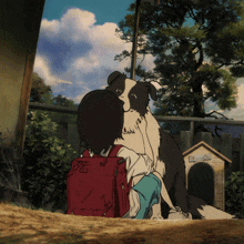 a boy with a red backpack is hugging a dog in front of a doghouse