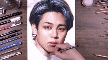 a drawing of a man with blue hair is on a table