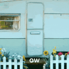 a white trailer with the word ow on the door