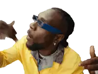a man wearing sunglasses and a yellow jacket is giving a thumbs up sign