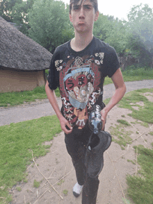 a young man wearing a t-shirt that says ' samurai ' on it