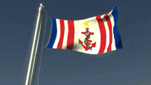 a red white and blue flag with an anchor and a star