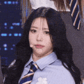 a close up of a girl wearing a tie