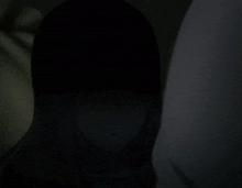 a girl with a surprised look on her face is standing next to a person
