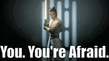 a poster with a woman holding a light saber and the words " you you 're afraid " below her