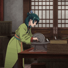 a girl with green hair is using a machine