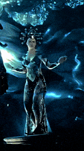 a painting of a woman with a crown on her head standing in a dark room