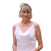 a woman wearing a white dress and a white hat