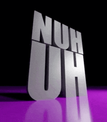 the word nuh uh is displayed on a purple surface