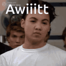 a young man in a white shirt with the word awiiiitt written on it