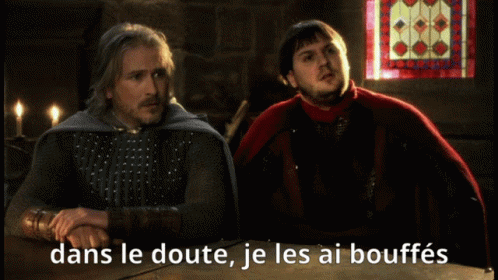two men sitting at a table with the caption dans le doute