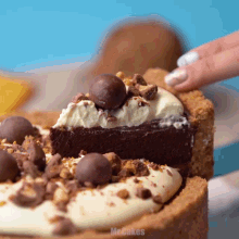 a person is taking a slice of cake from a mr. cakes cake