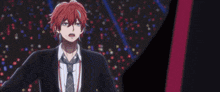 a man with red hair and blue eyes is shown in a foreign language