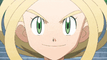 a close up of a girl 's face with green eyes
