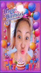 a woman blowing out candles on a birthday cake in a happy birthday frame